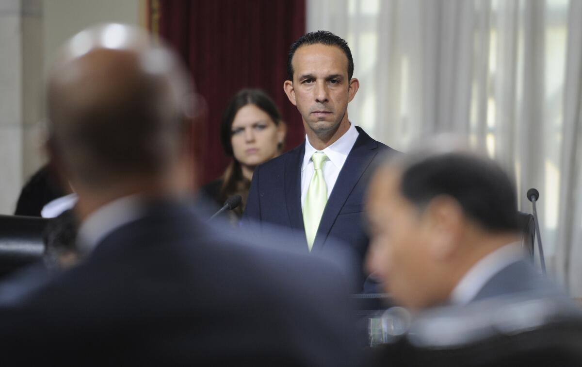 Los Angeles City Councilman Mitchell Englander listens during a Dec. 1 council meeting as representatives of Southern California Gas speak about the ongoing gas leak near Porter Ranch.