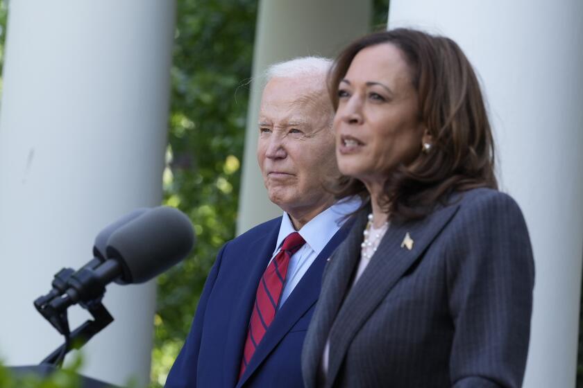 FILE - President Joe Biden listens as Vice President Kamala Harris speaks in the Rose Garden of the White House in Washington, May 13, 2024. With Biden ending his reelection bid and endorsing Harris, Democrats now must navigate a shift that is unprecedented this late in an election year. Democrats are set to hold their convention in Chicago in August. (AP Photo/Susan Walsh, File)