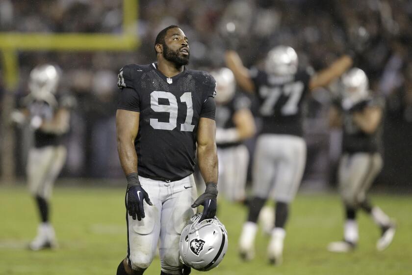 Oakland defensive end Justin Tuck walks off the field during the fourth quarter of the Raiders' only win of the season, against the Kansas City Chiefs on Nov. 20.