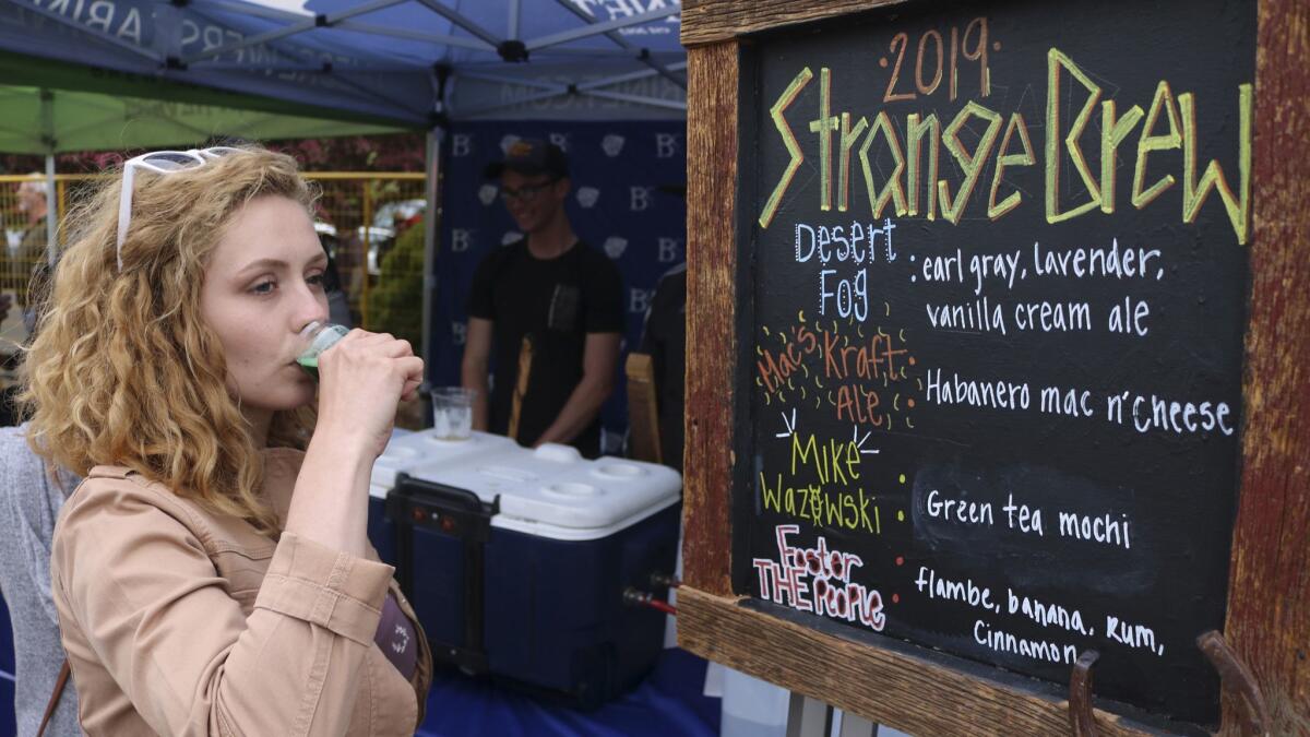 A woman tastes a green tea mocha beer at the Strange Brew Festival in Reno, Nev. on May 18.