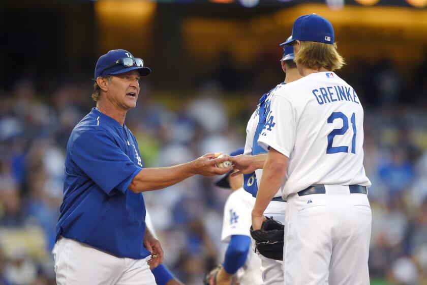 Dodgers Manager Don Mattingly takes starter Zack Greinke out of the game against the Cardinals in the seventh inning Sunday night.