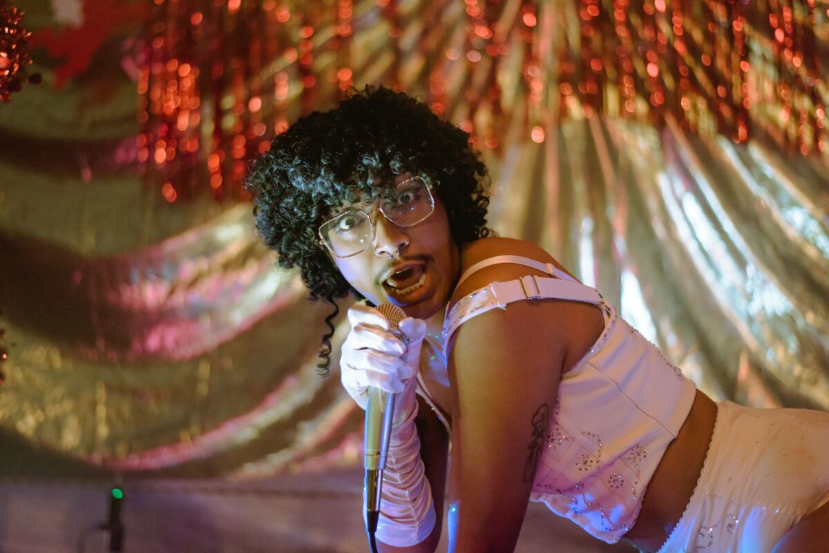 performer holds a microphone