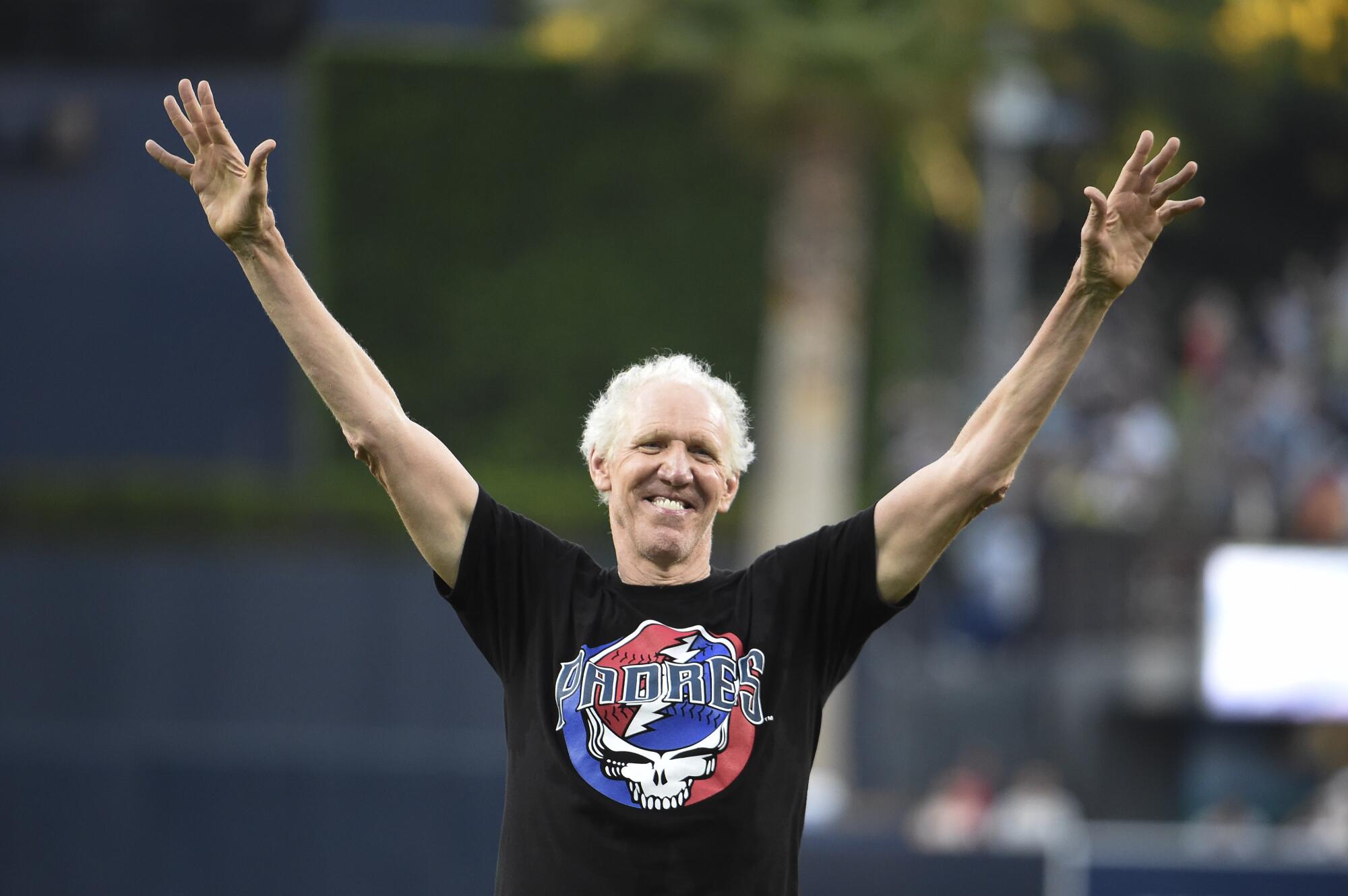 Bill Walton acknowledges the crowd after throwing a ceremonial first pitch at Petco Park.