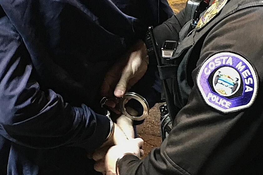 A Costa Mesa Police Department officer makes an arrest. 