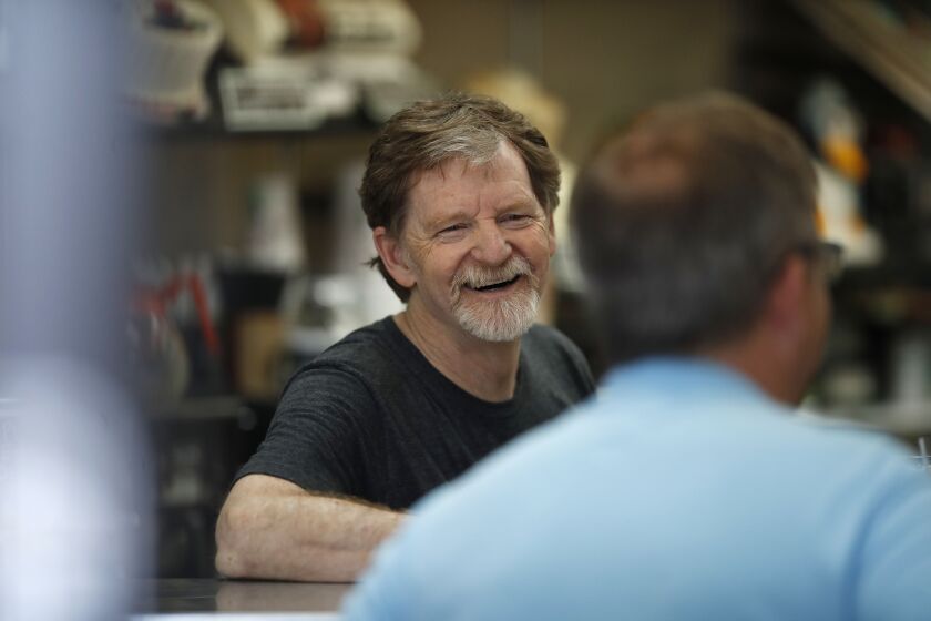 FILE - Baker Jack Phillips, owner of Masterpiece Cakeshop in Lakewood, Colo., manages his shop, June 4, 2018, after the U.S. Supreme Court ruled that his refusal to make a wedding cake for a same-sex couple because of his religious beliefs did not violate Colorado's anti-discrimination law. Now, the Colorado baker is challenging a separate ruling that he violated the state's anti-discrimination law by refusing to make a cake celebrating a gender transition. (AP Photo/David Zalubowski, File)