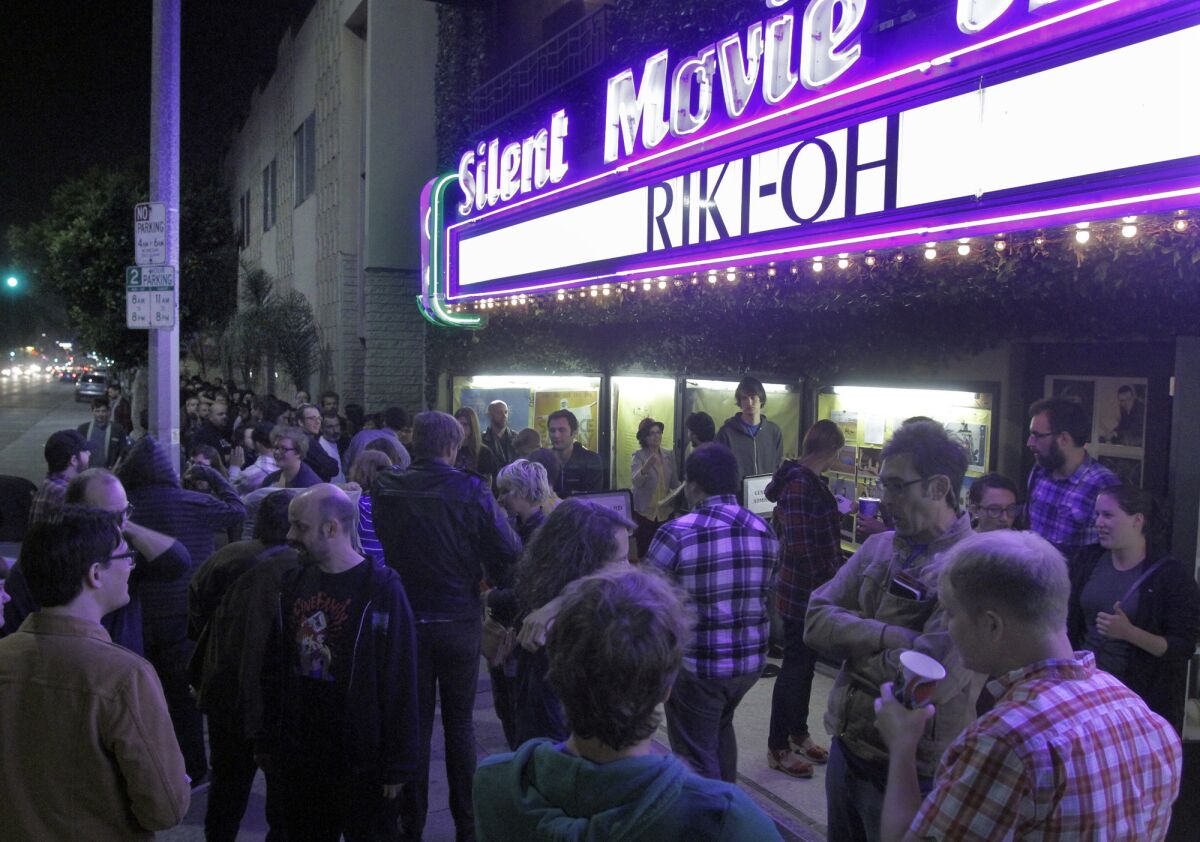 Moviegoers line up before a midnight showing of the movie "Riki-Oh" at the Cinefamily on L.A.'s Fairfax Avenue. (Lawrence K. Ho / Los Angeles Times)