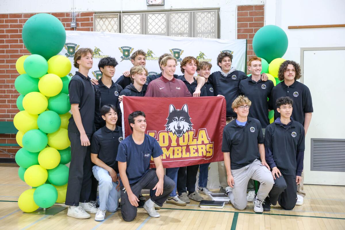 Edison's Ben Winokur stands with friends and teammates after signing with the Loyola-Chicago men's volleyball program.