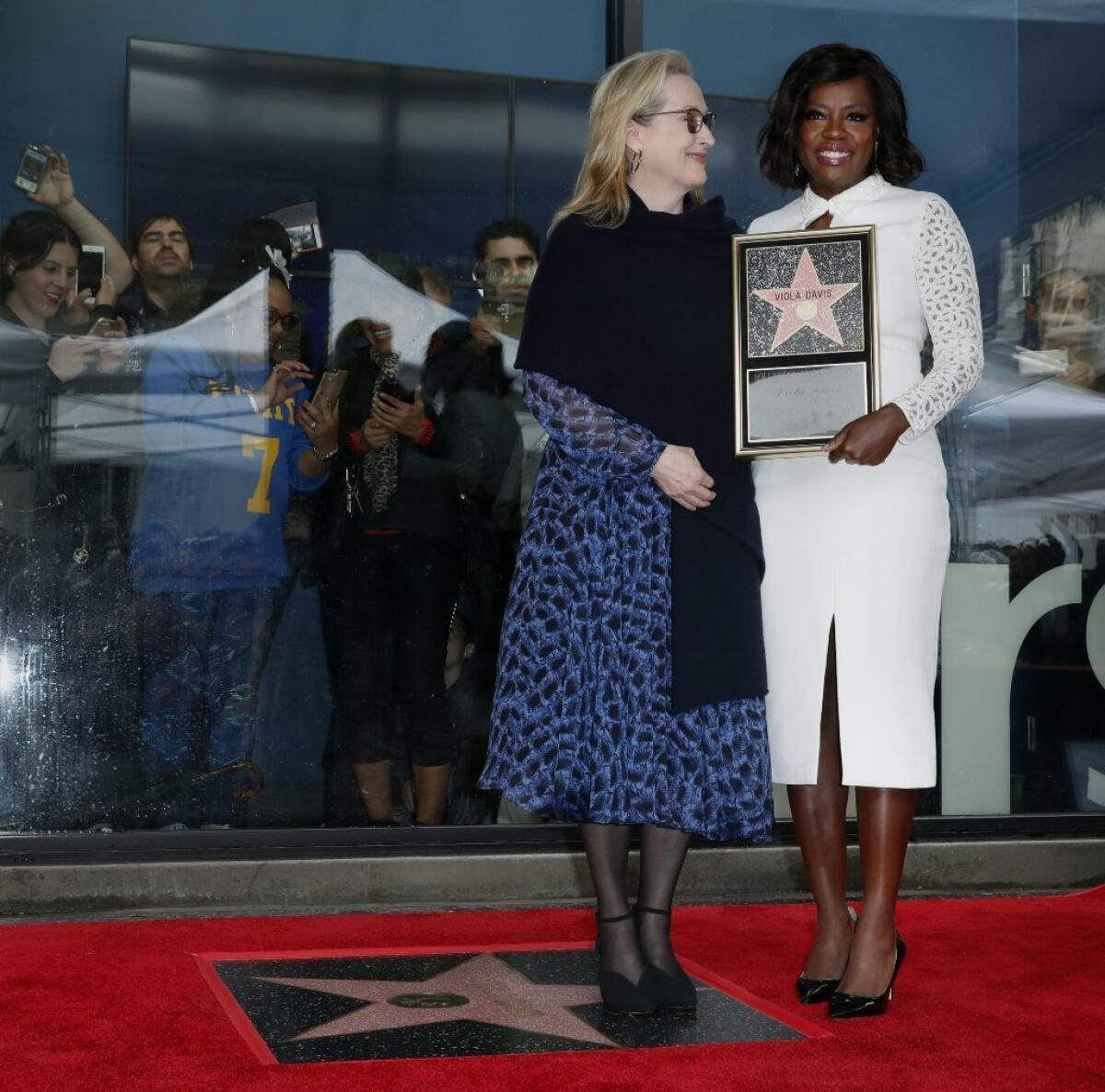 Viola Davis, right, and Meryl Streep at the ceremony celebrating Davis' new star on the Hollywood Walk of Fame on Jan. 5.