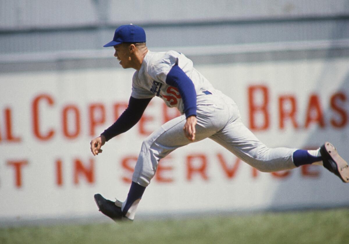A file photo from the 1970s shows the Dodgers' Maury Wills on the basepath.