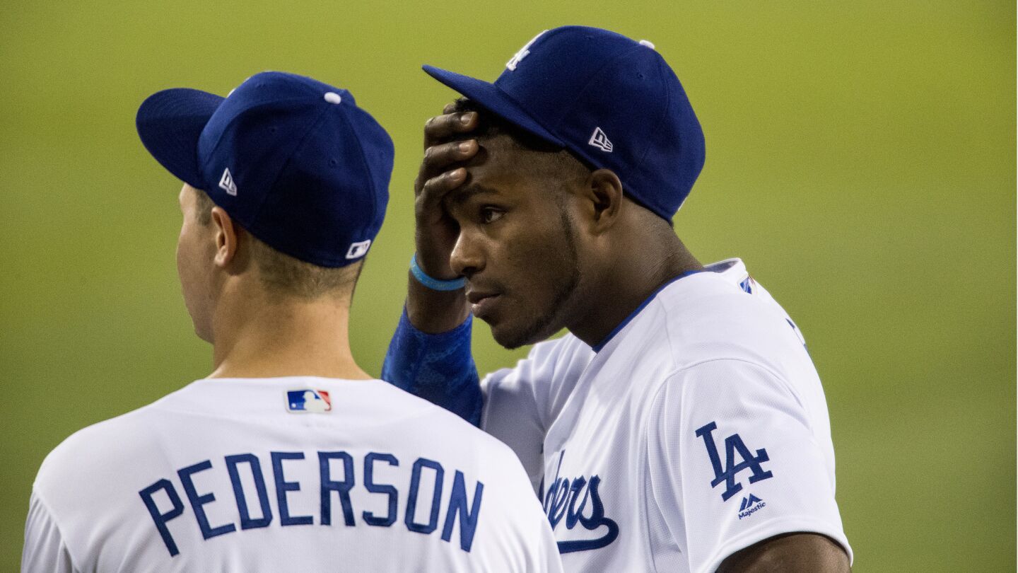 Dodgers right fielder Yasiel Puig, right, and center fielder Joc Pederson react after pitcher Yu Darvish was taken out of the game.