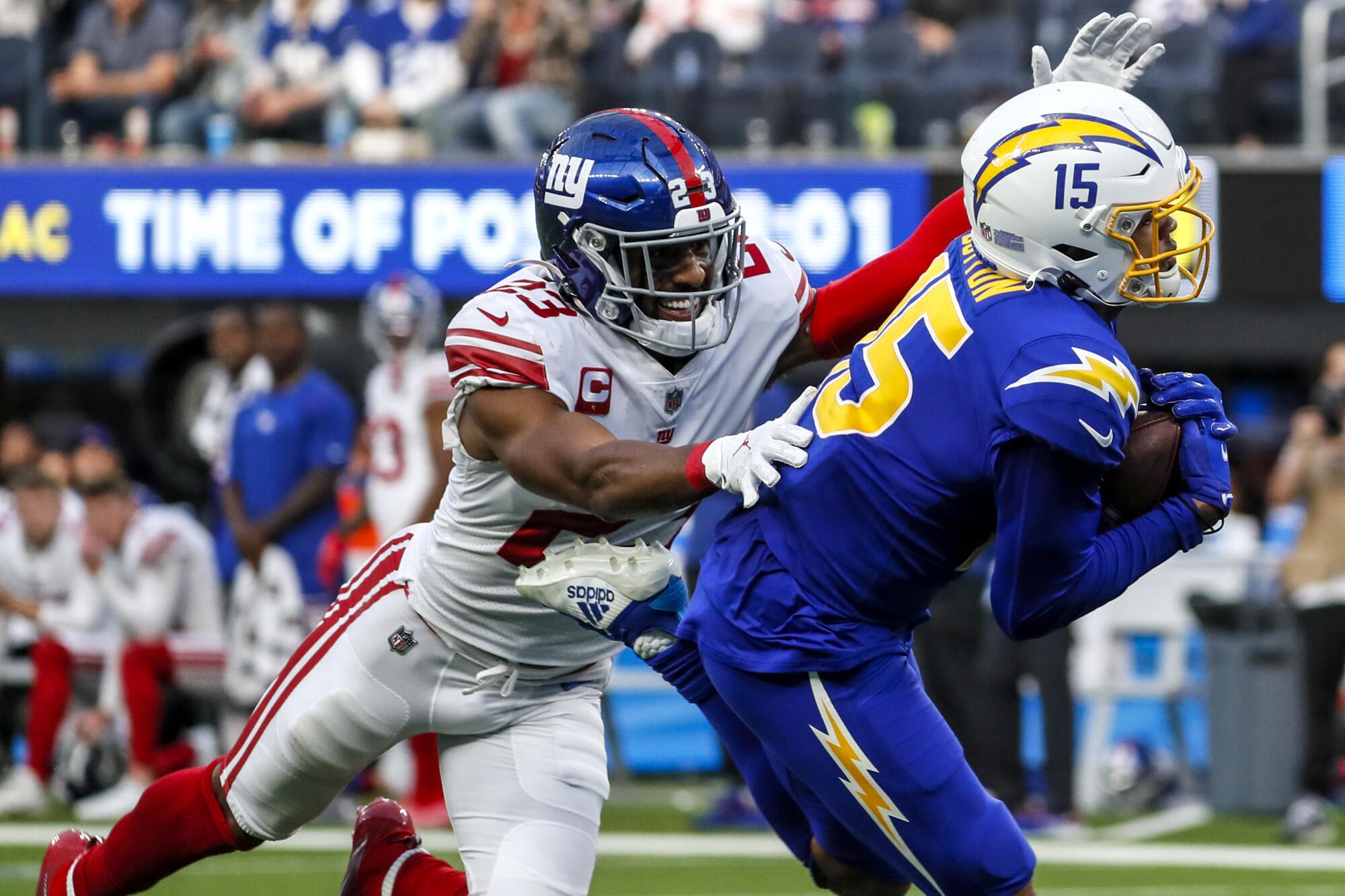 Chargers wide receiver Jalen Guyton hauls in a 59-yard touchdown pass over New York Giants safety Logan Ryan.