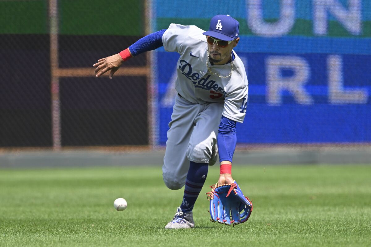 Dodgers right fielder Mookie Betts fields a run-scoring single by Kansas City's Vinnie Pasquantino.