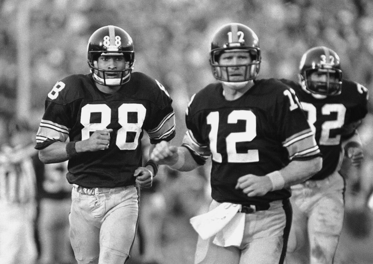 Receiver Lynn Swann, left, and quarterback Terry Bradshaw during Super Bowl XIV. 