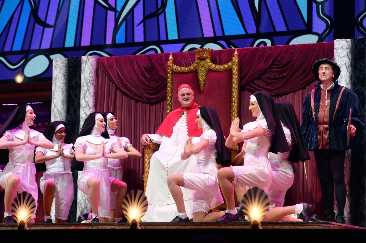 John Cleese, center, and Eric Idle perform on the opening night of "Monty Python Live (Mostly)" on Tuesday in London.