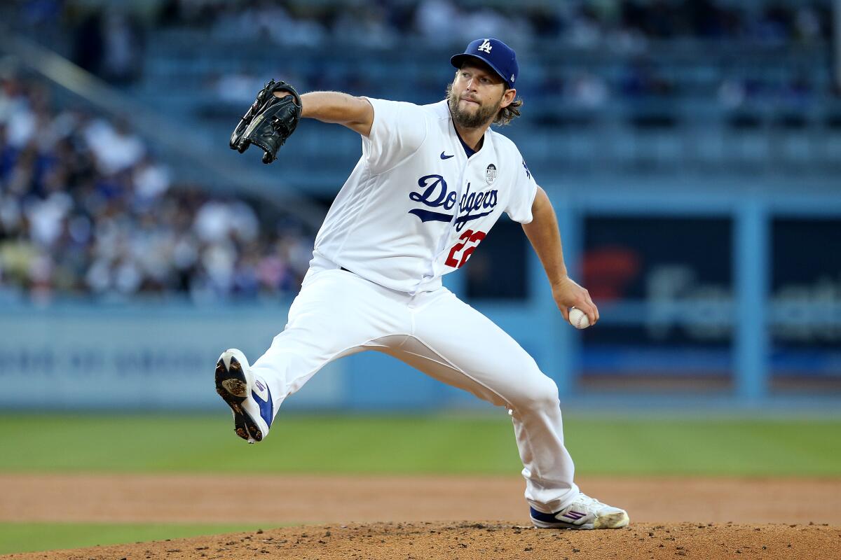 Dodgers starting pitcher Clayton Kershaw delivers during an 8-4 win over the New York Yankees at Dodger Stadium.