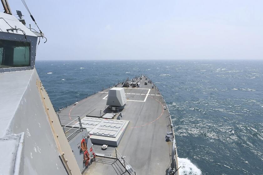 In this photo provided by the U.S. Navy, the Arleigh Burke-class guided-missile destroyer USS Halsey (DDG 97) conducts routine underway operations while transiting through the Taiwan Strait Wednesday, May 8, 2024. (Mass Communication Specialist 3rd class Ismael Martinez/U.S. Navy via AP)