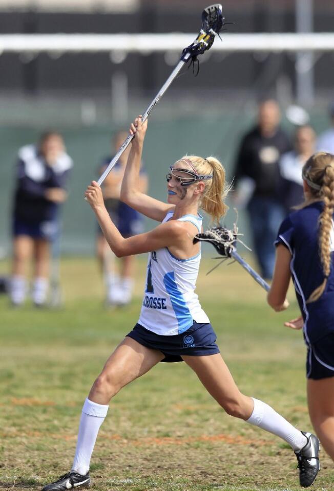 Corona del Mar High's Payton Carter fires a shot at the net against Newport Harbor during the Battle of the Bay game on Friday.