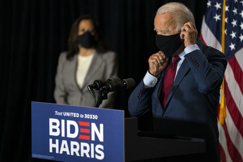 Trump And Biden Trade Barbs On Coronavirus Response Los Angeles Times