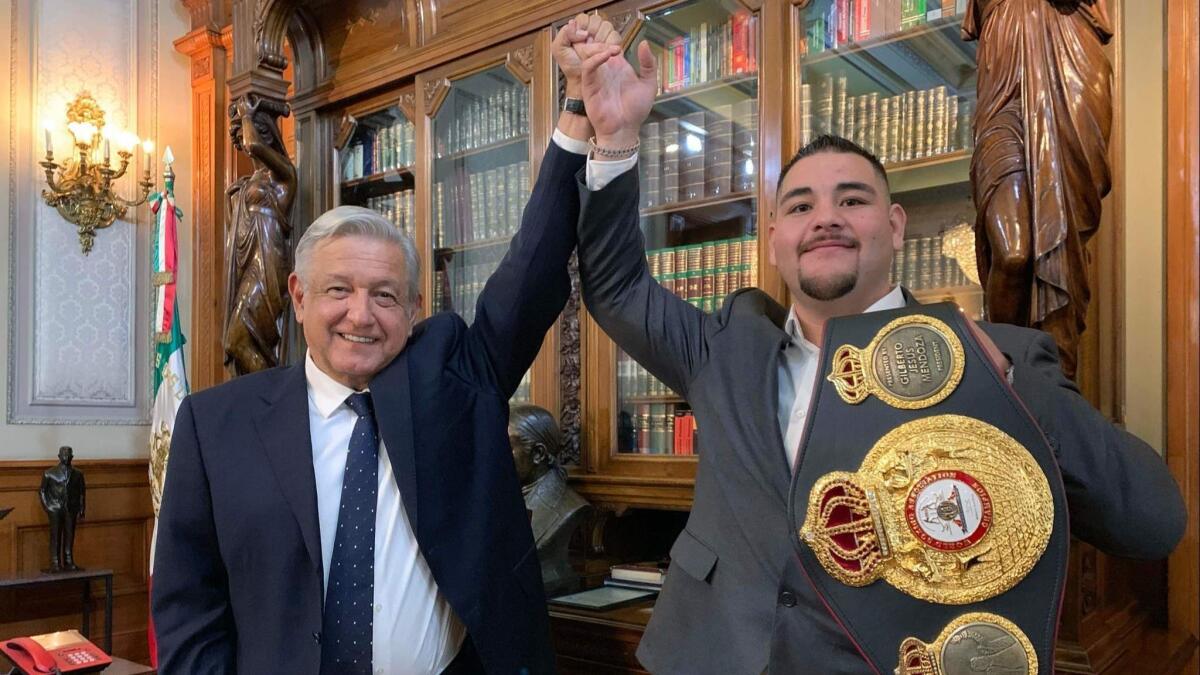 Mexican President Andres Manuel Lopez Obrador, left, posing with new heavyweight champion Andy Ruiz at the National Palace in Mexico City on June 11.