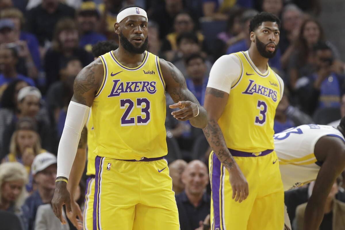 LeBron James (15 points) and new teammate Anthony Davis (22 points) helped the Lakers beat the Warriors at the new $1.4-billion Chase Center in San Francisco