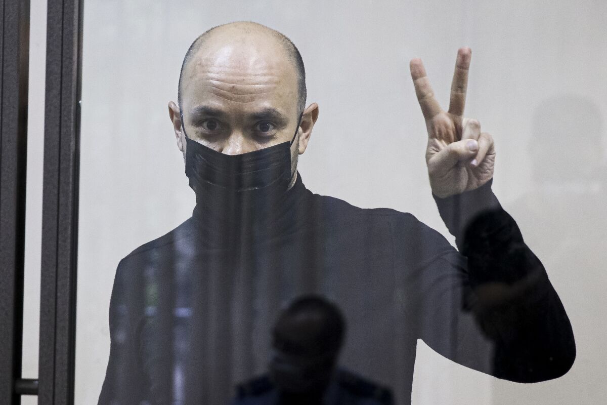 FILE - Andrei Pivovarov, head of the Open Russia movement, gestures during a court session in Krasnodar, Russia, Wednesday, June 2, 2021. Andrei Pivovarov, former head of the Open Russia group, was sentenced to four years in prison for "directing an undesirable organization," a criminal offense under a 2015 law. He has maintained his innocence and has insisted that the charges against him were brought because of his plans to run for parliament in September 2021. (AP Photo, File)