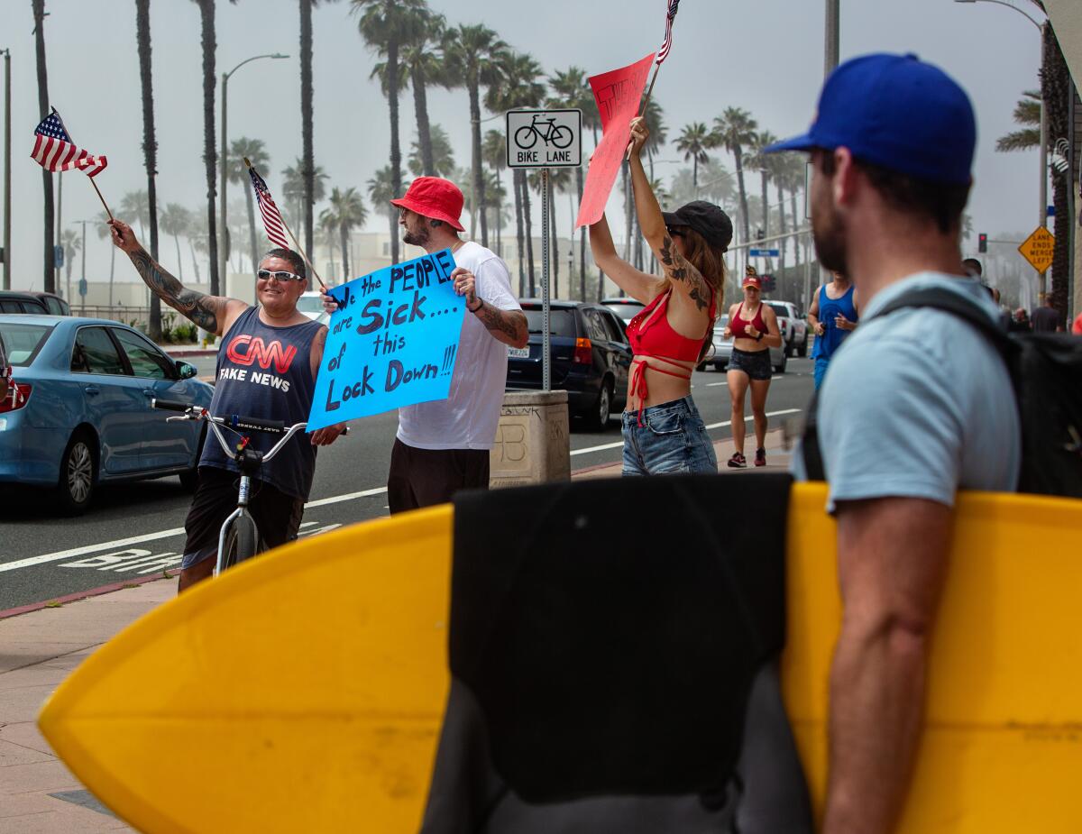 Demonstrators protest beach closures in Huntington Beach last week.