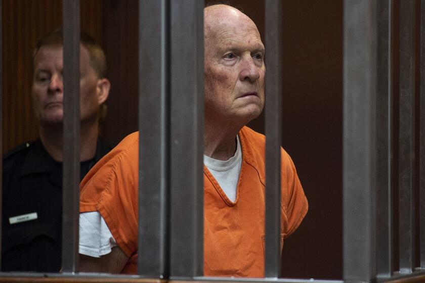 Joseph James DeAngelo stands in a Sacramento, Calif., jail court on Tuesday, May 29, 2018, as a judge weighed how much information to release about the arrest of the former police officer accused of being the Golden State Killer. He is suspected in at least a dozen killings and roughly 50 rapes in the 1970s and '80s. (Paul Kitagaki Jr./The Sacramento Bee via AP, Pool)