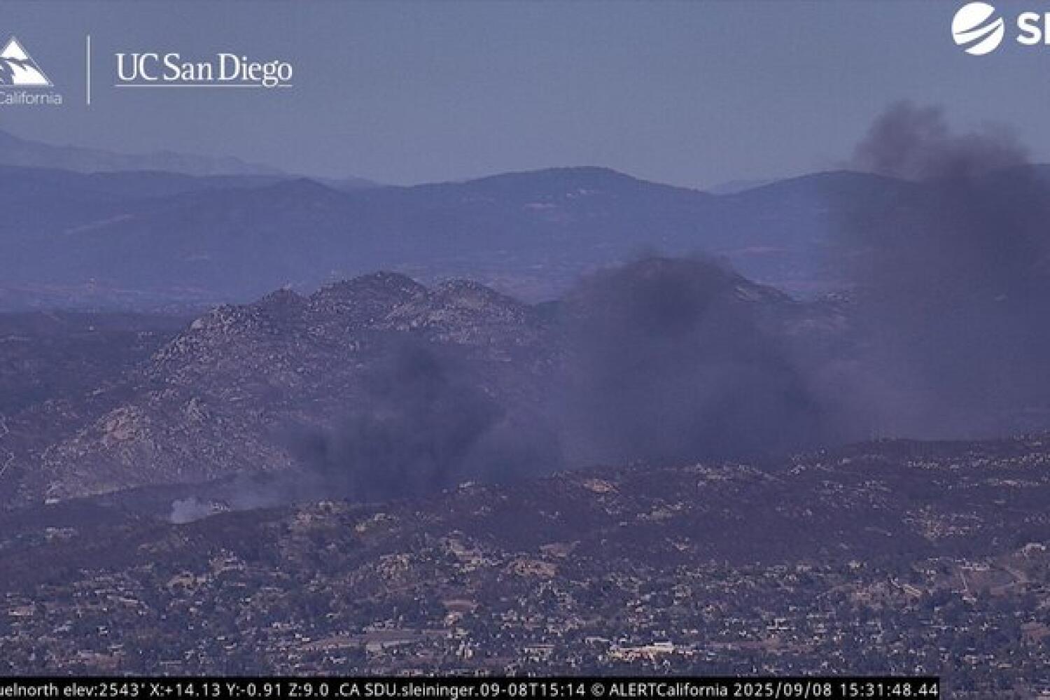 The Coches fire burns Monday afternoon north of Interstate 8 in San Diego County.