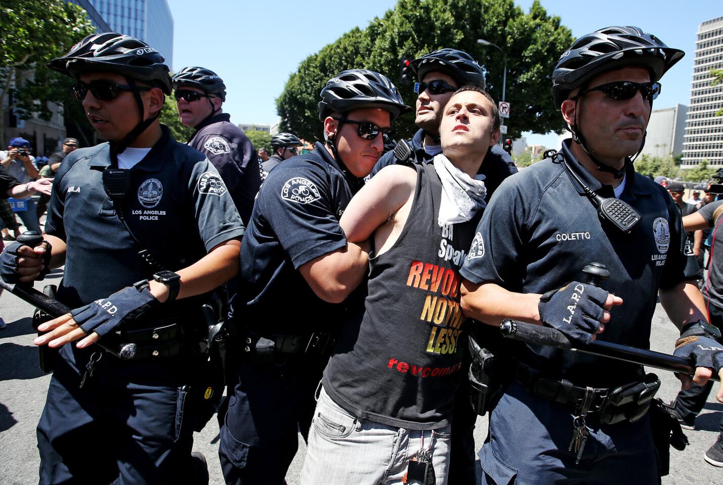 LAPD officers arrest a protester during a May Day march in downtown Los Angeles.