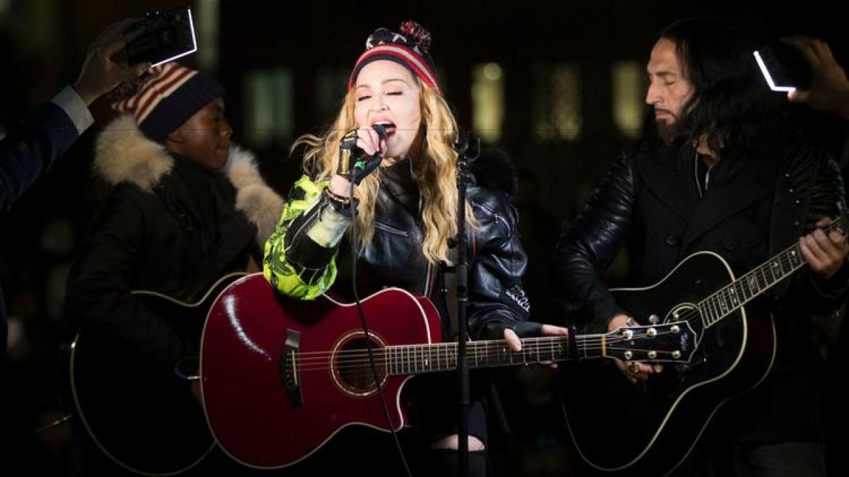 Madonna surprised New Yorkers with a pop-up concert to support Hillary Clinton on Monday.