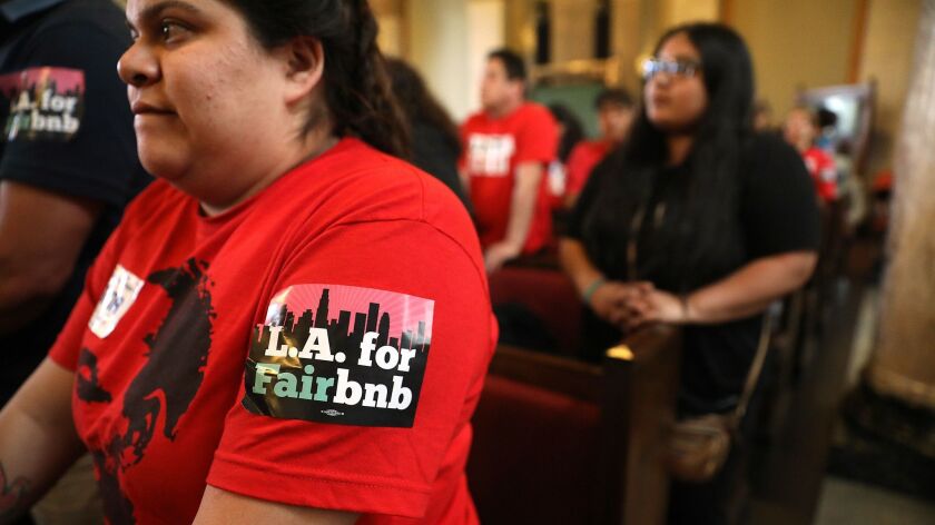 Genesis Diaz, 24, of South Los Angeles attends a meeting on Airbnb-type rentals at City Hall in April.
