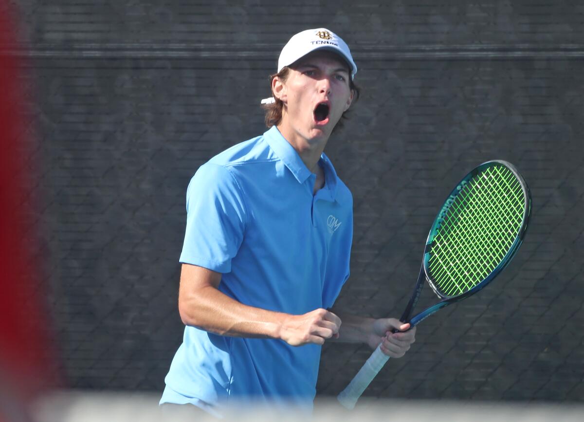 CdM's Jonathan Hinkel reacts to putting away a volley between two opponents during Wednesday's match.