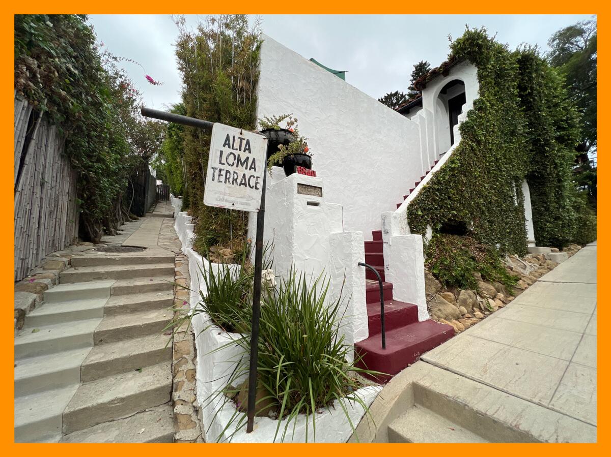 A steep outdoor stairway with a signpost that reads Alta Loma Terrace