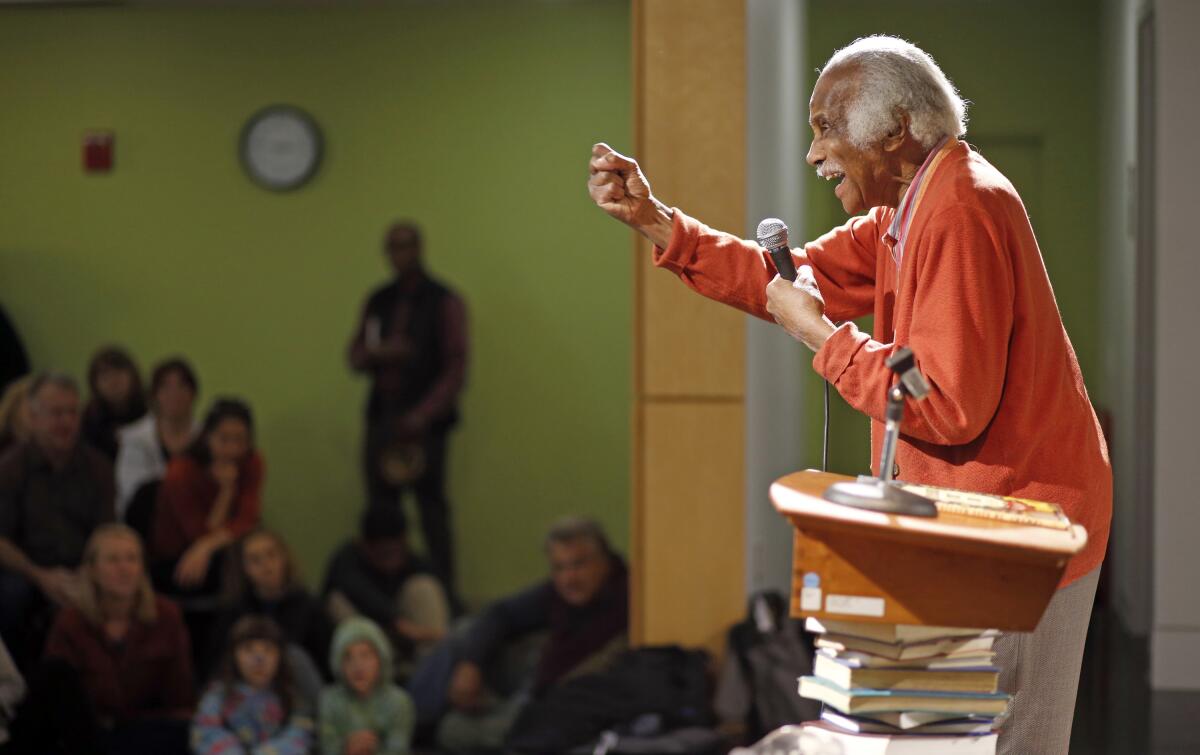 Ashley Bryan discusses his book "Freedom Over Me" at the Portland Public Library in Maine.