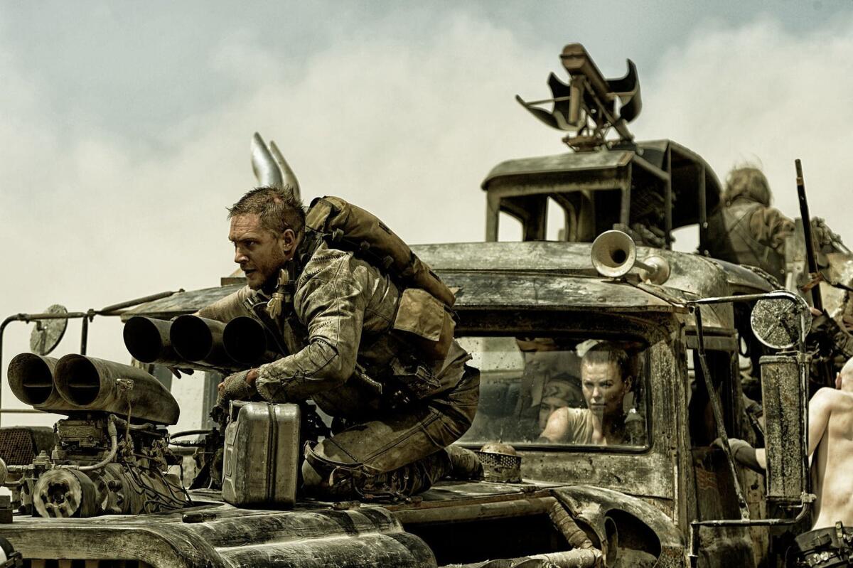 Tom Hardy, left, and Charlize Theron appear in a scene from "Mad Max: Fury Road."