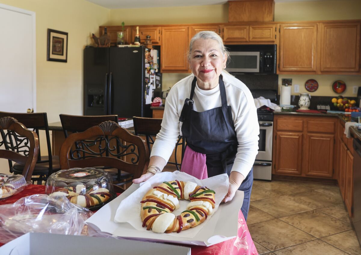 Marisela Alvarado displays a rosca de Reyes at her home on Tuesday, Jan. 4, 2022.