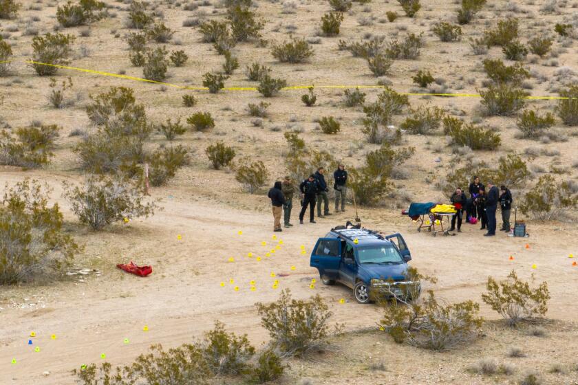 Adelanto, CA - January 24: San Bernardino sheriff's department officials investigate scene where five were found dead in a remote area of SanBernardino county north of Adelato January 24, 2024. (Brian van der Brug / Los Angeles Times)