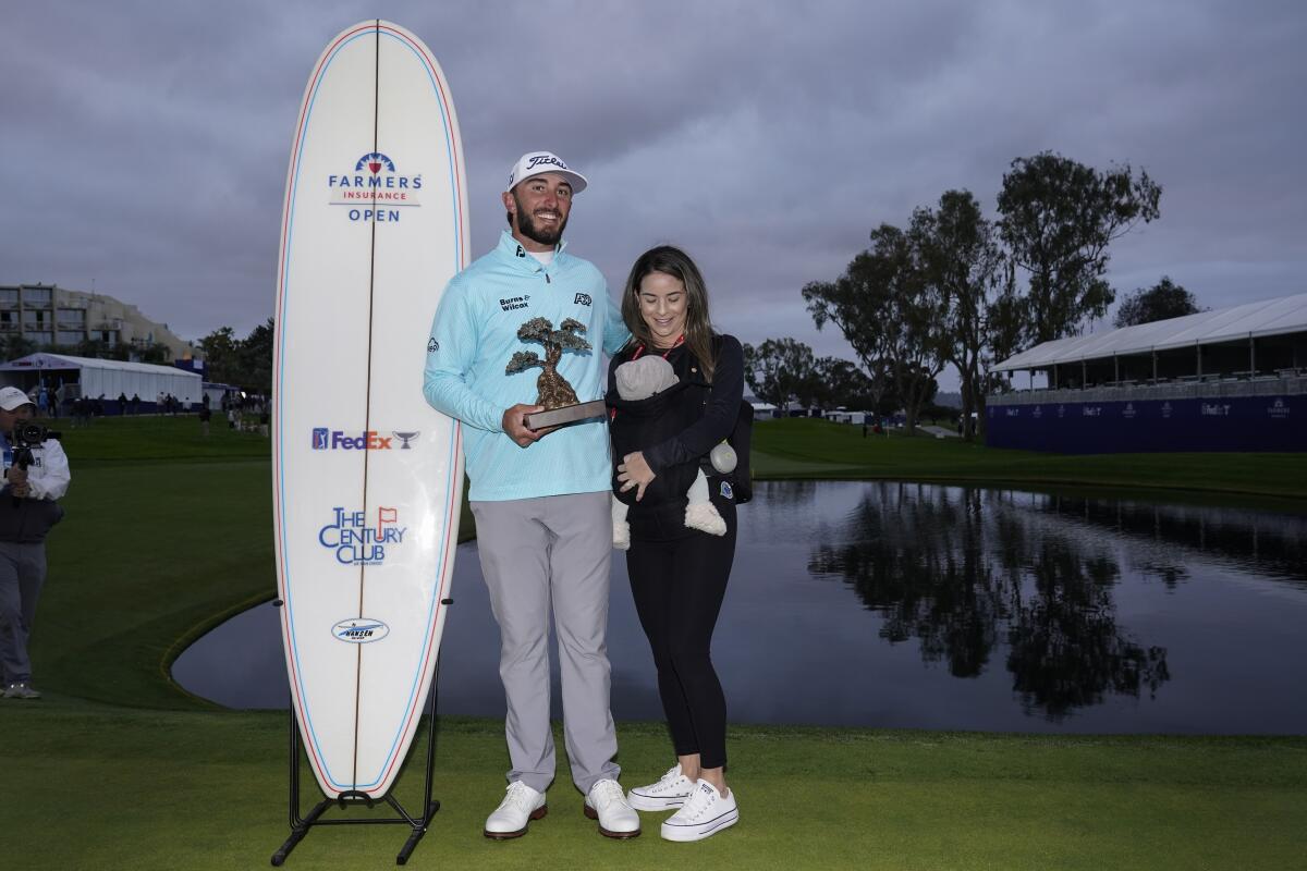 Max Homa stands alongside his wife Lacey and their baby, Cam.