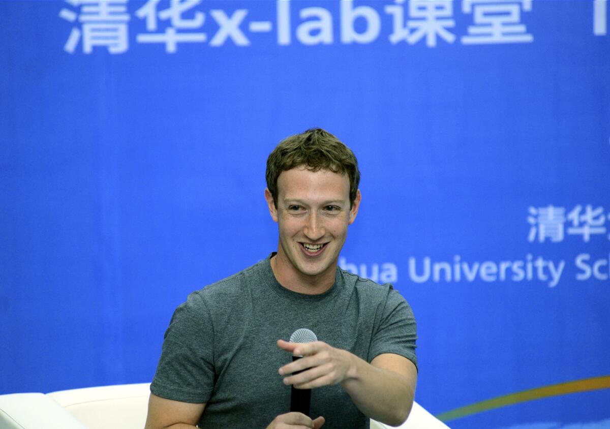 Mark Zuckerberg speaks with students at Beijing's Tsinghua University in a photo released by the school on Oct. 22.