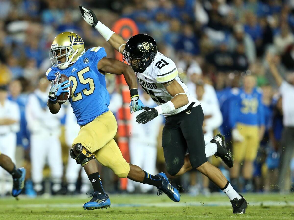 Buffaloes safety Jared Bell chases down Bruins running back Damien Thigpen on a 27-yard gain to the eight-yard line that set up a UCLA touchdown in the fourth quarter.
