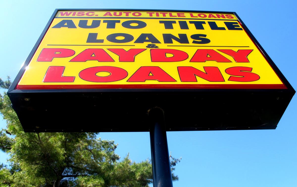 A sign for a Wisconsin Auto Title Loans store in Madison, Wis., in 2010.