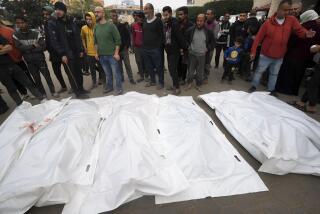 Palestinians mourn their relatives killed in the Israeli bombing of the Gaza Strip in Deir al Balah, Gaza Strip, on Thursday, Dec. 28, 2023. (AP Photo/Adel Hana)