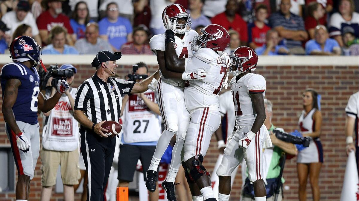 Alabama's Jerry Jeudy (4) celebrates a touchdown during the first half against the Mississippi Rebels on Saturday.