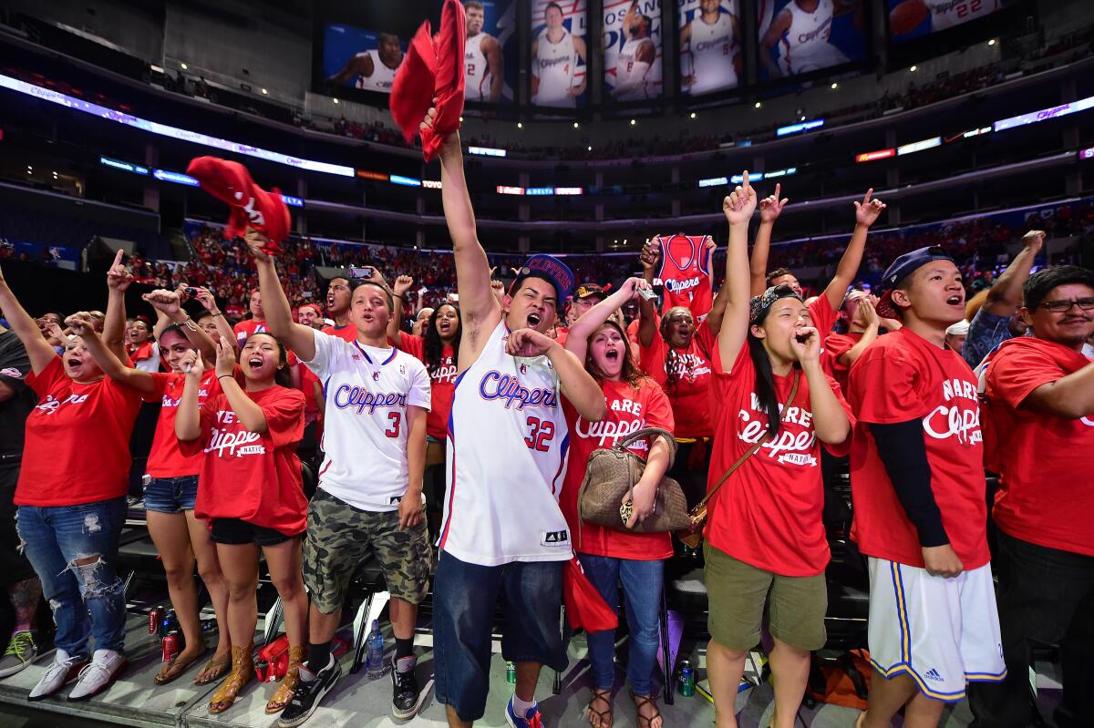 Clippers fans cheer during a fan festival at Staples Center in August 2014.
