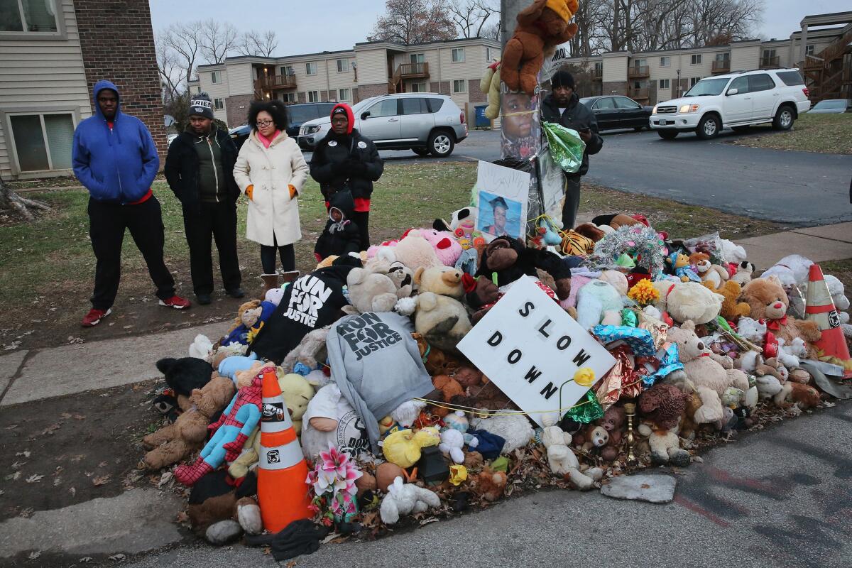Residents begin to gather at the Michael Brown memorial ahead of the grand jury announcement on Monday in Ferguson, Missouri.