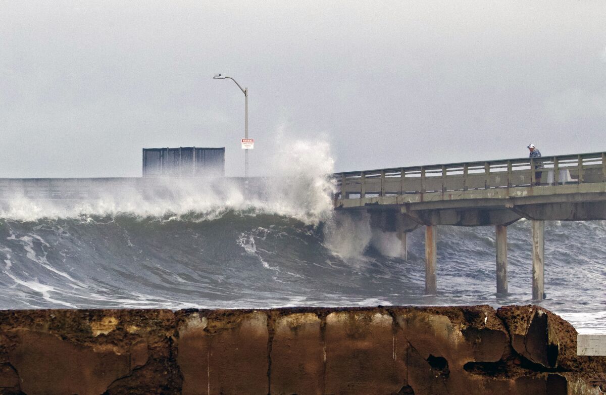 A wave hits the Ocean Beach Pier on Jan. 4.