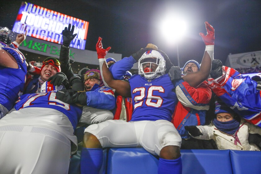 Buffalo Bills' Devin Singletary (26) celebrates his second touchdown during the second half of an NFL football game against the New York Jets, Sunday, Jan. 9, 2022, in Orchard Park, N.Y. (AP Photo/Joshua Bessex)