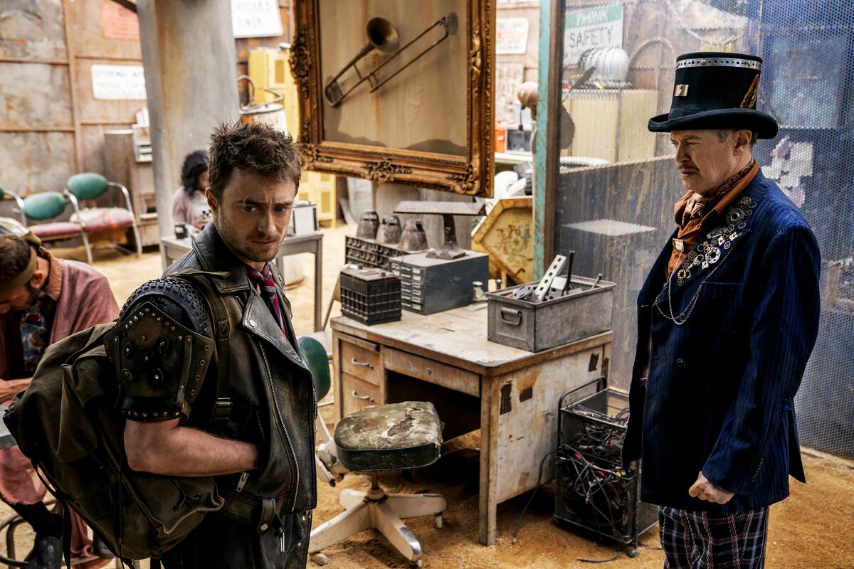 Daniel Radcliffe (left) and Steve Buscemi in a scene from Miracle Workers.