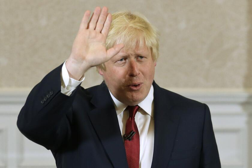 Former London Mayor Boris Johnson waves June 30 as he announces that he will not run for leadership of Britain's ruling Conservative Party.