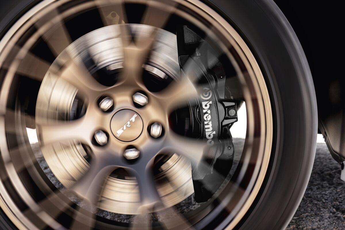 SRT/Brembo Ultra-high-performance Brake Package, with six-piston monoblock aluminum caliper and 15.4-inch vented and slotted rotors front, 13.8-inch rear with four-piston calipers rear.